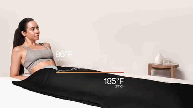 A snapshot of someone enjoying the soothing effects of the HydraGun Heat Pod, basking in its targeted heat therapy for a rejuvenating and calming experience.